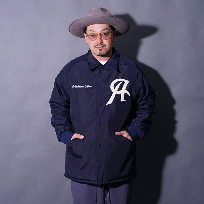 AMERICAN WANNABE アメリカンワナビー「TEAM LOGO LONG COACH JACKET / NAVY」ロングコーチジャケット AWJ-250202 メンズ アメカジ 上衣 ブランド名 アメカジジャケット アメカジメンズ コーチジャケット ヴィンテージテイスト