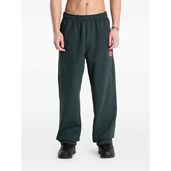 ナイキ メンズ 心地好いズボン下 ボトムス Fleece tie-hem track pants Grey