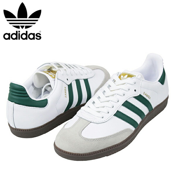 white adidas trainers with green stripes