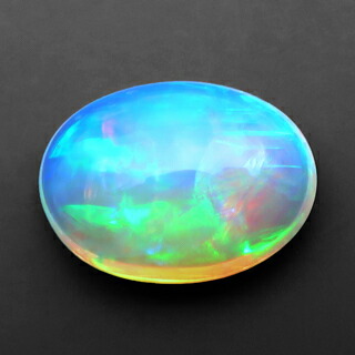 エチオピアオパール ルース 4.17ct 淡橙の地色に橙 緑 赤の遊色 エチオピア 瑞浪鉱物展示館 5222｜瑞浪鉱物展示館