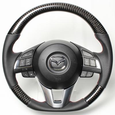 レアルCX-5 KE 2012/2～2017/2 ステアリング ブラックカーボン レッド&times;ブラック ユーロステッチ｜オートパーツ ダイレクト