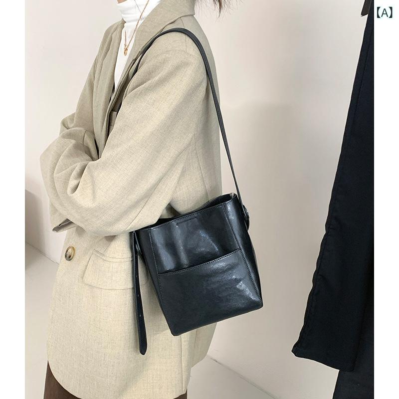 レ トロ 風 植物 タンニン 鞣し 牛革 製 小型 バケット バッグ 2026 年 新作本 革 ニッチ デザイン ポケット 付き ハンドバッグ 兼 ショルダーバッグ 兼 クロスボディバッグ 女性 用｜ビーチドロップ