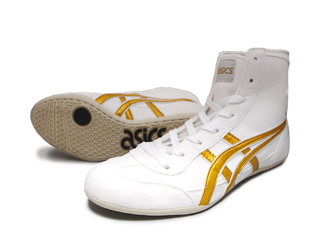 gold and white wrestling shoes