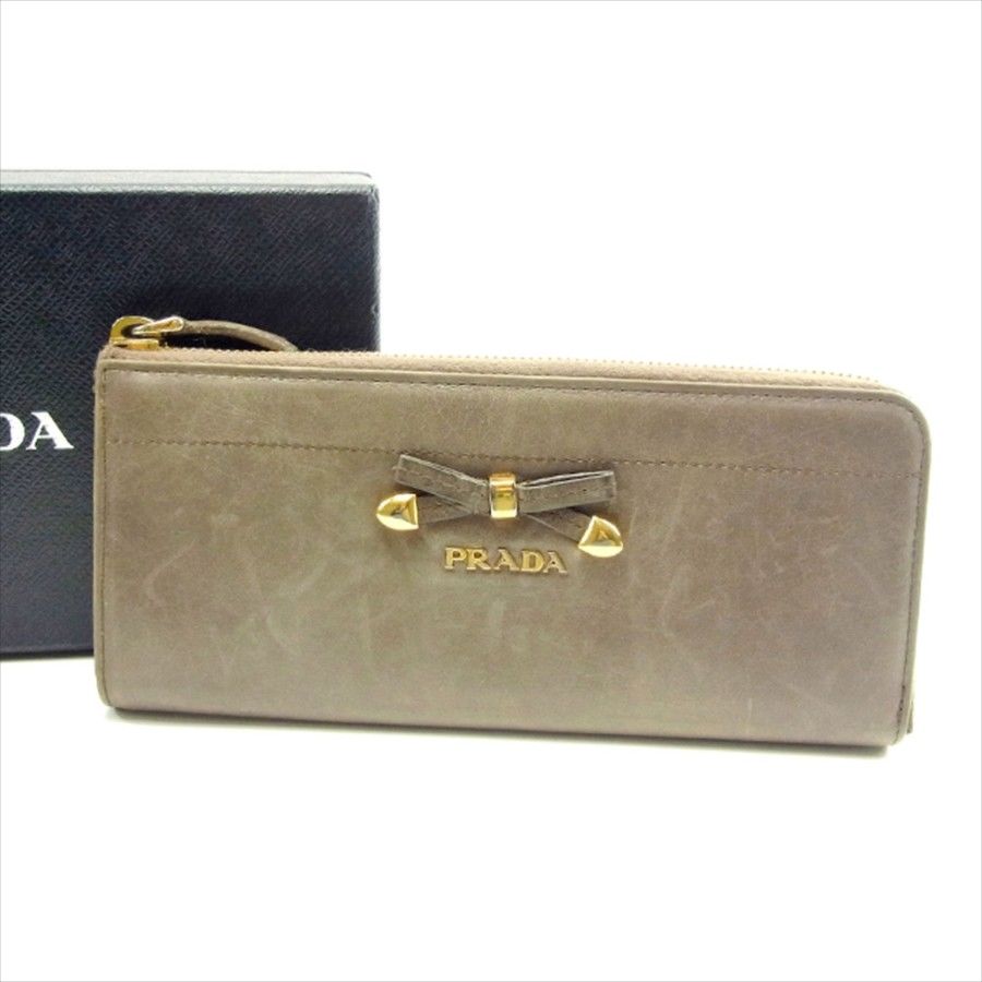 【お買い物マラソン★30％OFFクーポン】プラダ 長財布 L字ファスナー リボンモチーフ ベージュ レザー PRADA 【プラダ】 t4607s 【中古】 ブランド ハイブランド ヴィンテージ 送料無料