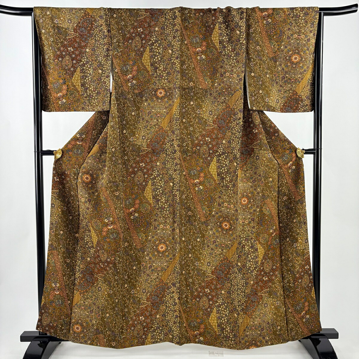 小紋 身丈161.5cm 裄丈66.5cm M 袷 寄せ柄 草花 縮緬 茶色 正絹 秀品 【中古】