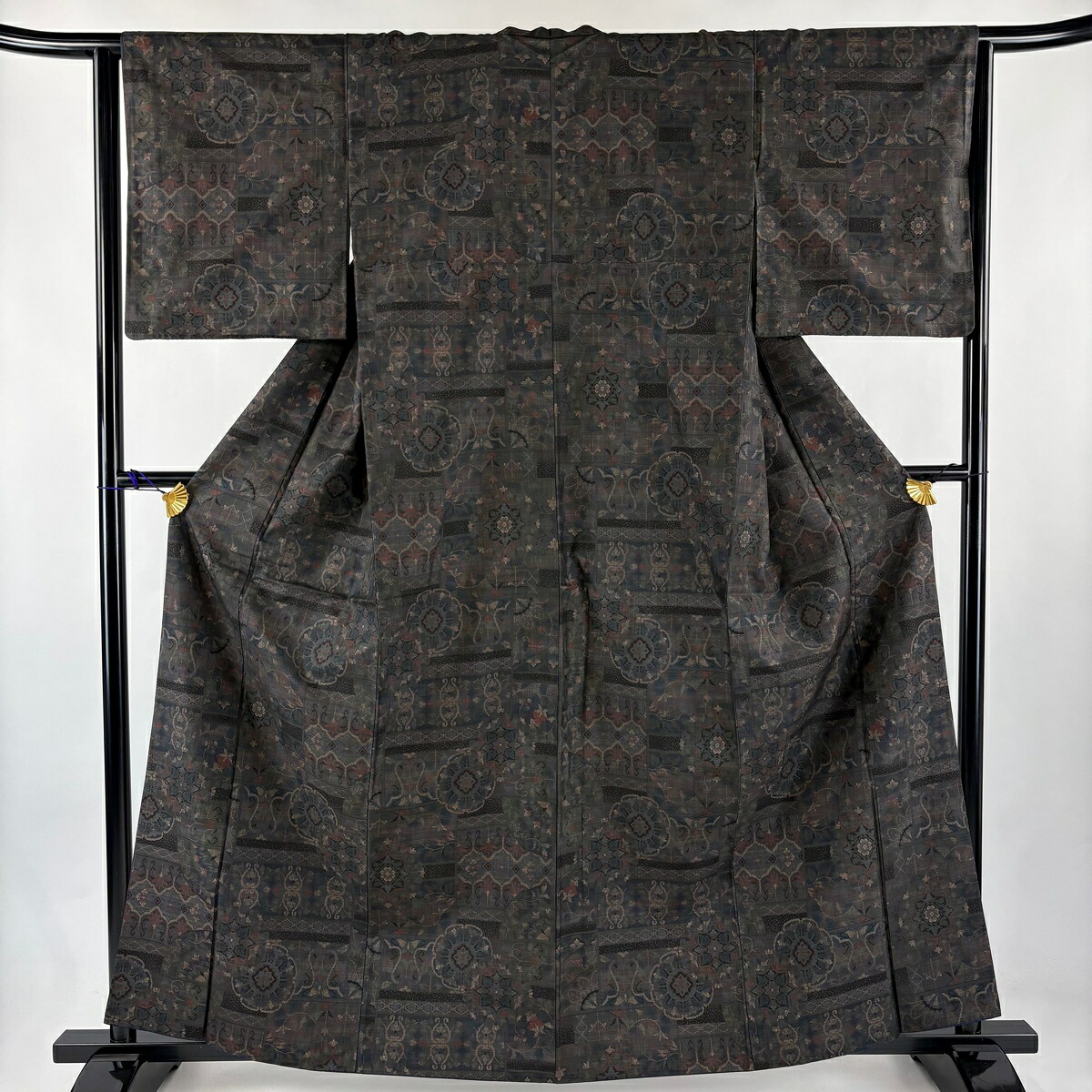 紬 身丈162cm 裄丈63.5cm S 袷 華文 花唐草 茶紫 正絹 秀品 【中古】