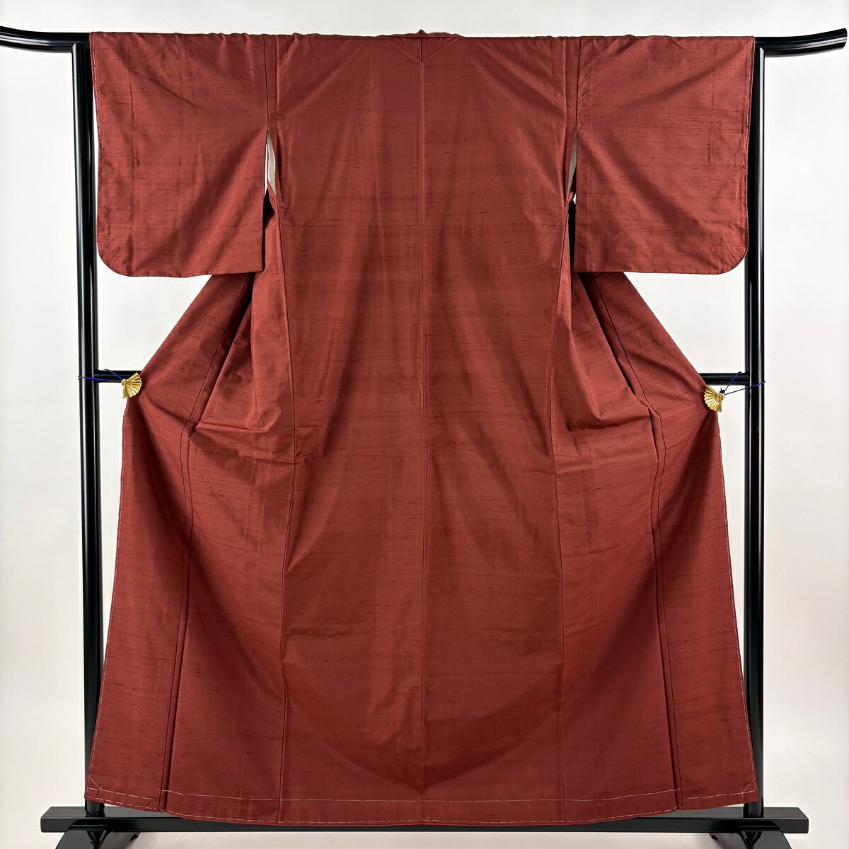 【美品】 大島紬 身丈160cm 裄丈64cm M 袷 都喜ヱ門 車輪梅格子 証紙あり 無地 赤茶 正絹 名品 【中古】