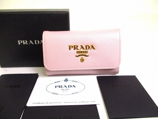 【未当て嵌める庫入れ品】 プラダ PRADA サフィアーノ なめし革 4連 手当たり容れもの 手当たり輪っか メンズ レディース 点火装置さくら色 【中古】