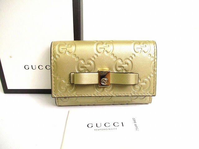 【未使用保管品】 グッチ GUCCI GG シマ レザー リボンモチーフ 6連 キーケース キーリング メンズ レディース シャンパンゴールド 【中古】
