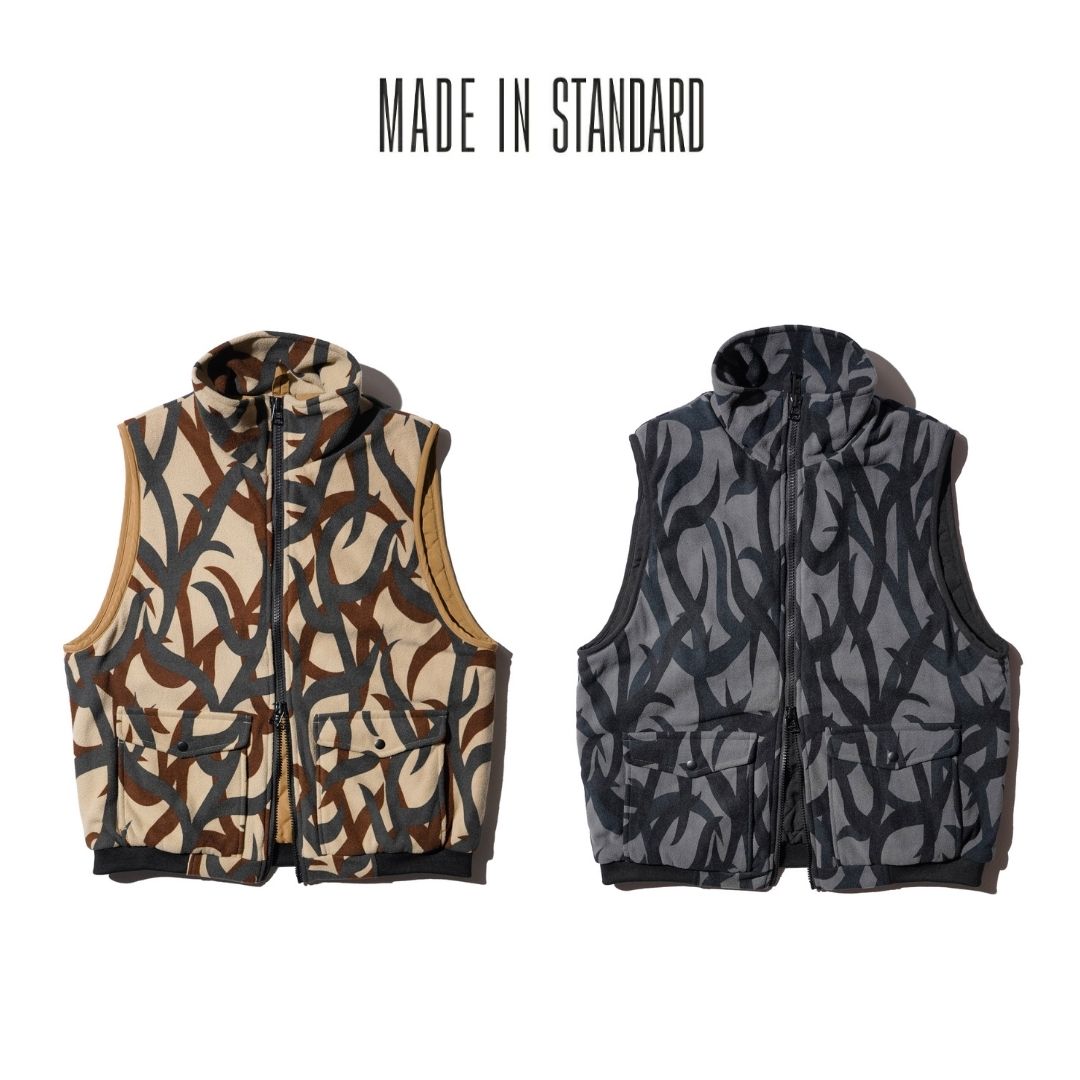 【MADE IN STANDARD / メイドインスタンダード】QUILT LINED PRINTED ACTIVE VEST ベストトライバルカモ 総柄 フリース アウター 中綿 サーモライト メンズ レディース 秋冬