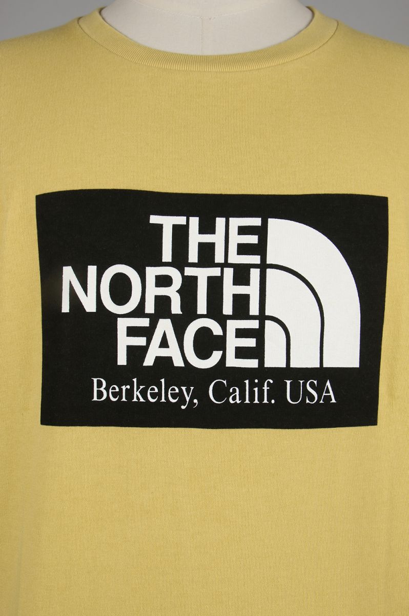 mustard north face t shirt