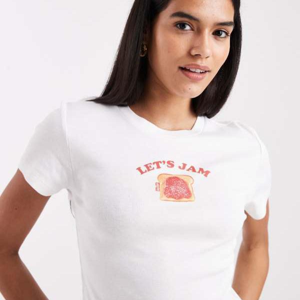 リーヴァイズジーンズ  Levi\u0027s リーヴァイズジーンズのフルーツ柄もの言う花ティーシャツ（白いこと） トップス レディース 亭主もち インポートブランド 弱められた大いさから途轍も無い大いさまで Tシャツ・カットソー-レディースファッション-トップス