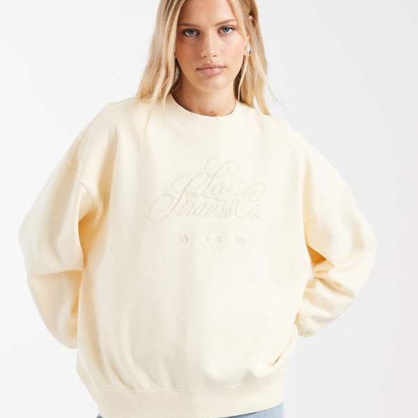 リーヴァイズジーンズ  Levi\u0027s リーヴァイズジーンズのヴィンテージウォッシュオーバーサイズグラフィックスウェットシャツ（エクリュ） トップス レディース お上さん インポートブランド たわい無い大きさから気が大きい大きさまで