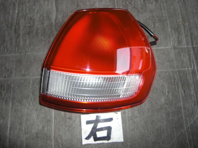 【中古】中古部品 ウイングロード WHNY11 右ﾃｰﾙﾗﾝﾌﾟ 【3310050100-001280699215500】