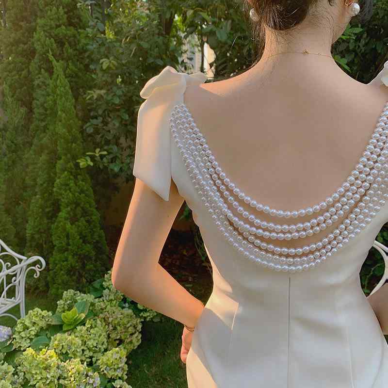 ワンピース 女性用 白色 Vネック 無袖 ミドル丈 ペンシルスカート 背中開き 蝶結び ウエスト中間 修身 純欲風 接触冷感 伸縮性 フォーマル イブニング 軽量 吸湿速乾 カジュアル 普段使い 春夏 秋冬