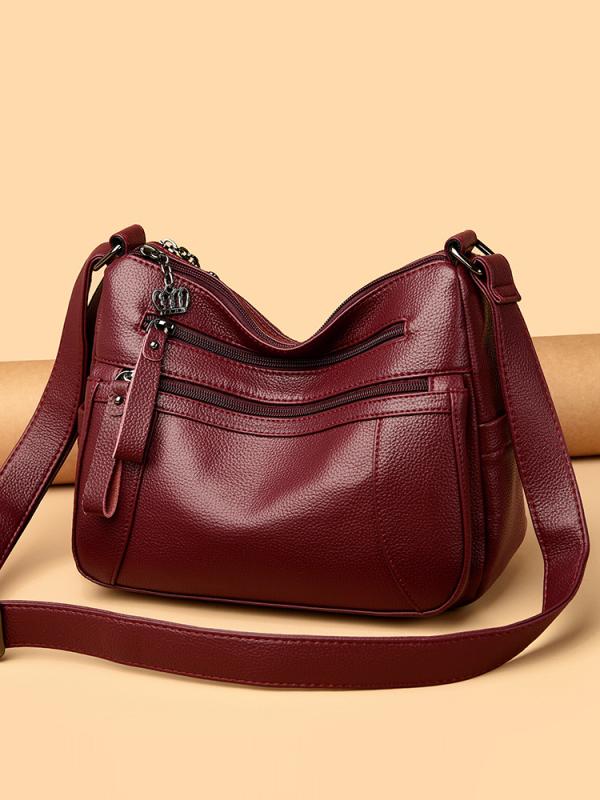ショルダーバッグ 女性用 斜めがけ ソフトレザー コンパクト 横型 真皮 牛革 複合素材 黒 赤 青 街頭スタイル トレンド 復古 カジュアル 日常使い ファッション 単肩 軽量 車縫い ステッチ コントラストカラー ジッパー開閉 ソフト 夏 ポケット