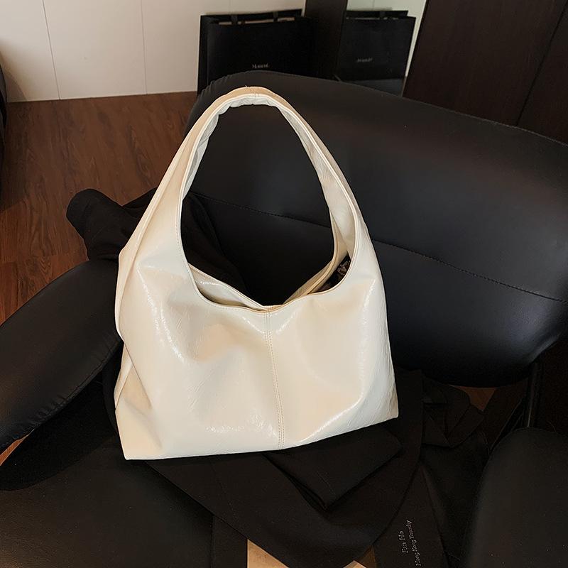 トートバッグ 女性用 韓国風 シンプル 縦型 方形 ショルダーバッグ 大容量 斜めがけ ミディアムサイズ PU素材 ソフト ジッパー開閉 携帯ポケット 街頭ファッション トレンド 車縫いステッチ 単肩ストラップ 日常使い 通勤 ショッピング ミルクイエロ