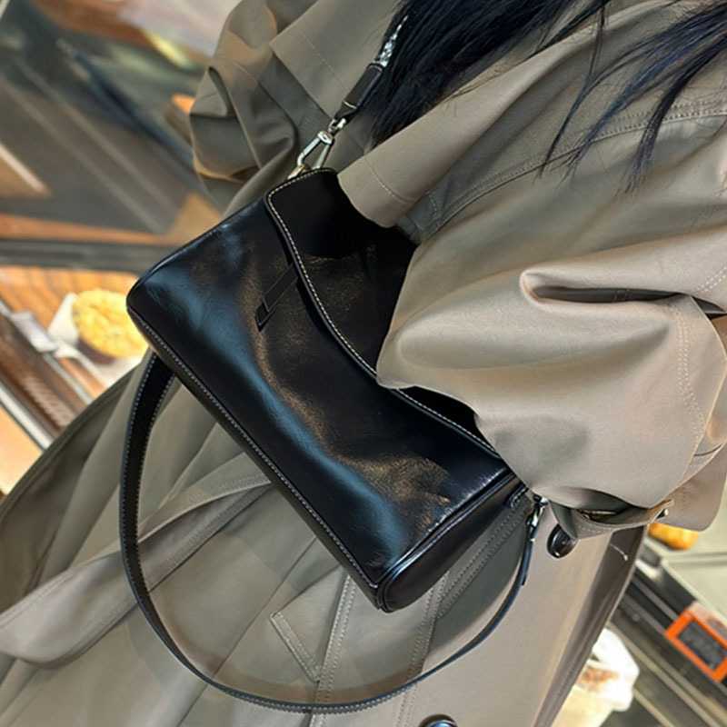 腋の下包女2025新型大容量斜め包頭層牛革百合シングルショルダーバッグ高級感真皮女包
