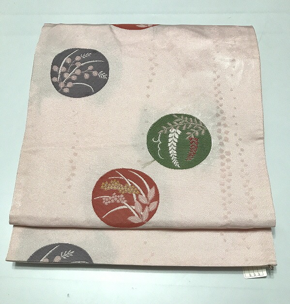 【中古】名古屋帯 化繊 ピンク地に丸紋文様