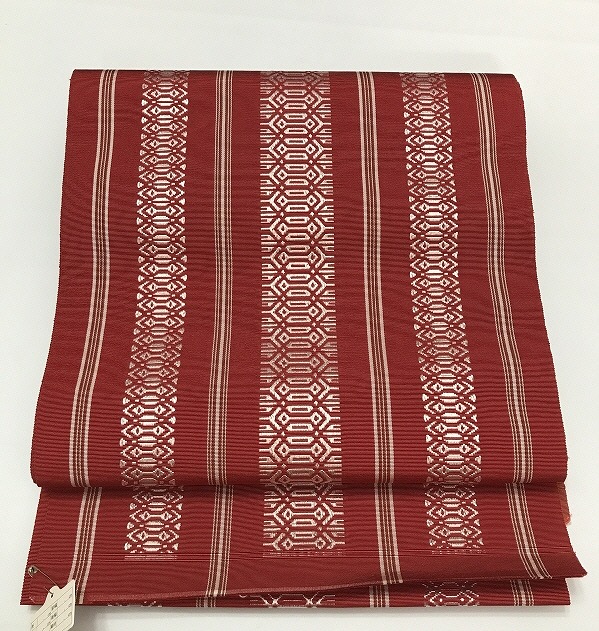 【中古】名古屋帯 化繊 赤茶地に独鈷文様 八寸 全通柄 単帯 最強配送 シーズン春