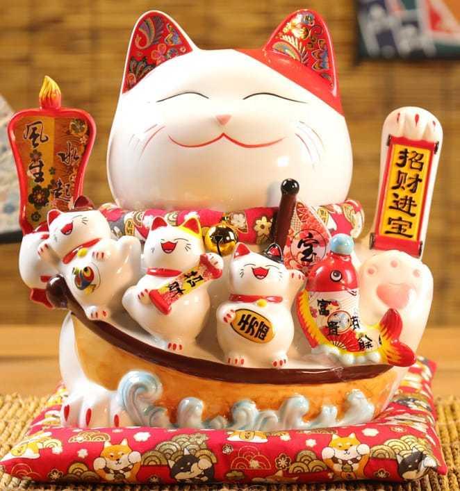 開店祝賀会 開業祝賀会 電動 招き猫 まねき猫 白磁製 瀬戸もの製 大型 割り増し金 青写真 座蒲団付 蓄電池 墨付き お手々お手伝いさん かわいく 手招き します 自動小銃で 腕を振ります ラッキーアイテム 暮らし向き向