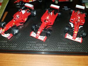 【送料無料】ホビー　模型車　車　レーシングカー スカラシューマッハフェラーリhotwheels scala 143 f1 3 x car set schumacher ferrari 20002001 e 2002
