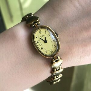 【送料無料】腕時計　ヴィンテージラグジュアリーゴールデンハートブレスレットテストアナログvintage luxury golden luch heart bracelet women yellow tested analog wristwatch