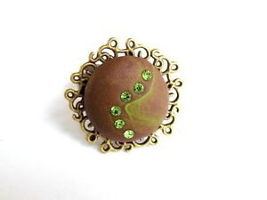 【送料無料】ジュエリー・アクセサリー ブロンズリングアラベスクブラウングリーンストラスポリマーbague bronze arabesques marron vert strass polymere
