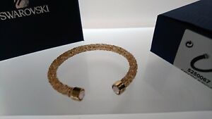 【貨物輸送無料】宝飾品・付属品 スワロフスキークリスタルダストゴールデンクリスタルカフブレスレットビッグswarovski crystaldust bracciale cuff golden crystal 5250067 grande m nuovo
