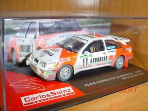 【送料無料】模型車 モデルカー フォードシエラコスワースカルロスサインツポルトガルford sierra rs cosworth carlos sainz 143 portugal 1987