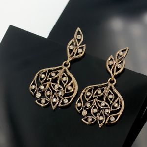 【送料無料】ピアス　ピアス　ゴールデンキャンドルアイロンツリーアールデコシートクリスタルohrringeohren golden kerzenhalter bgel baum art deco blatt kristall aa22