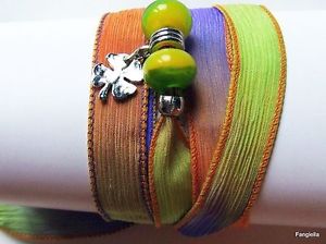 【送料無料】ブレスレット　アクセサリ―　クローバ4オレンジドアgreen purple orange bracelet silk shade handicraft clover 4 leaves door