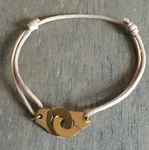 【送料無料】ブレスレット　アクセサリ&mdash;　ベージュコードゴールデンスチールトレンドブレスレットthe trend bracelet handcuffs on beige cotton cord adjustable golden steel｜hokushin