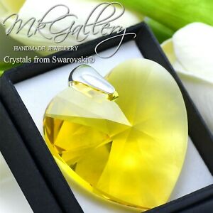 【送料無料】アクセサリー　ネックレス　ペンダントシルバースワロフスキーgrande ciondolo 925 argento 40mm cuorelight topaziocristalli di swarovski