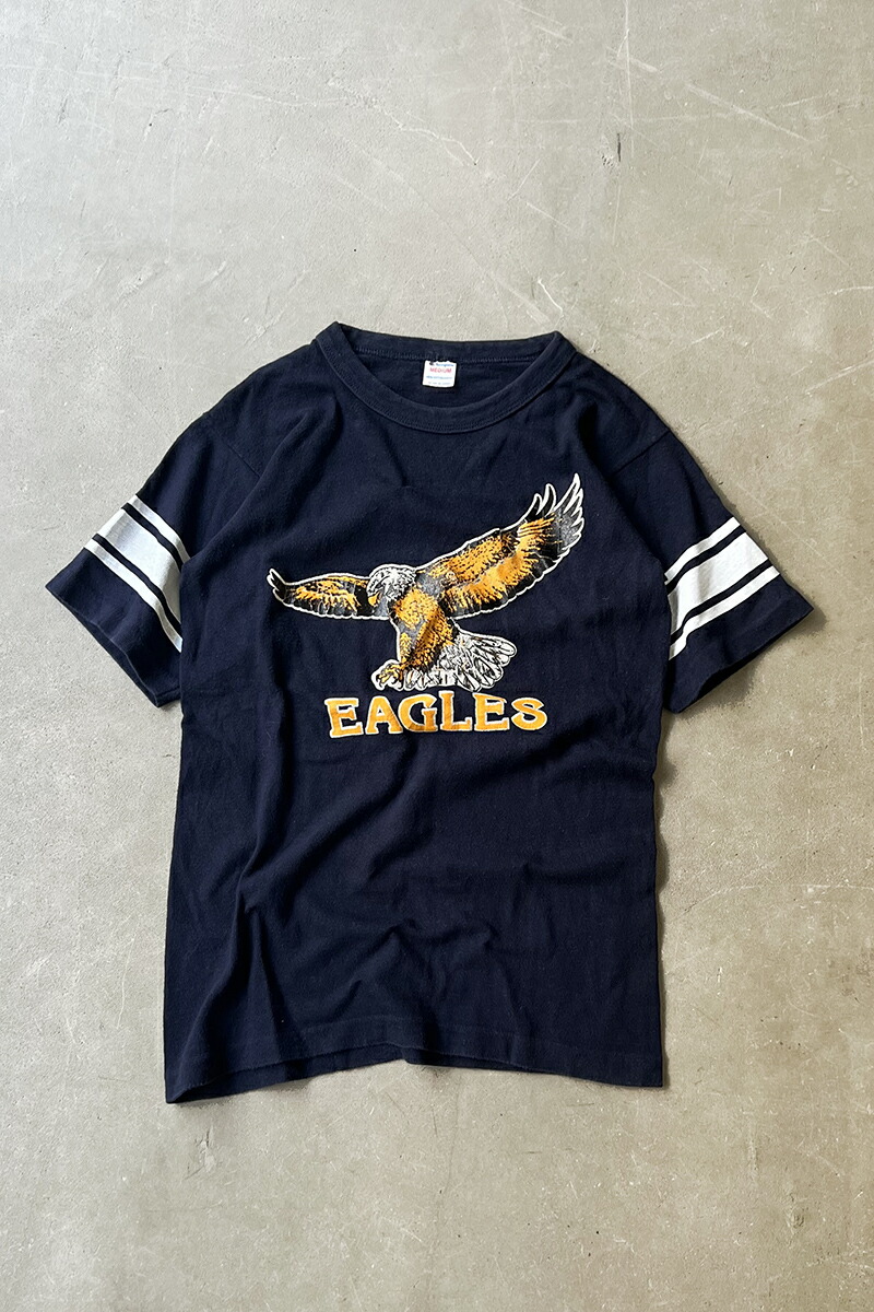 【中古】CHAMPION (はやりっ児) MADE IN USA 80\u0027S EAGLES T-SHIRT 亜米利加製  80年月日 イーグルス プルオーバー NAVY [SIZE: M USED]