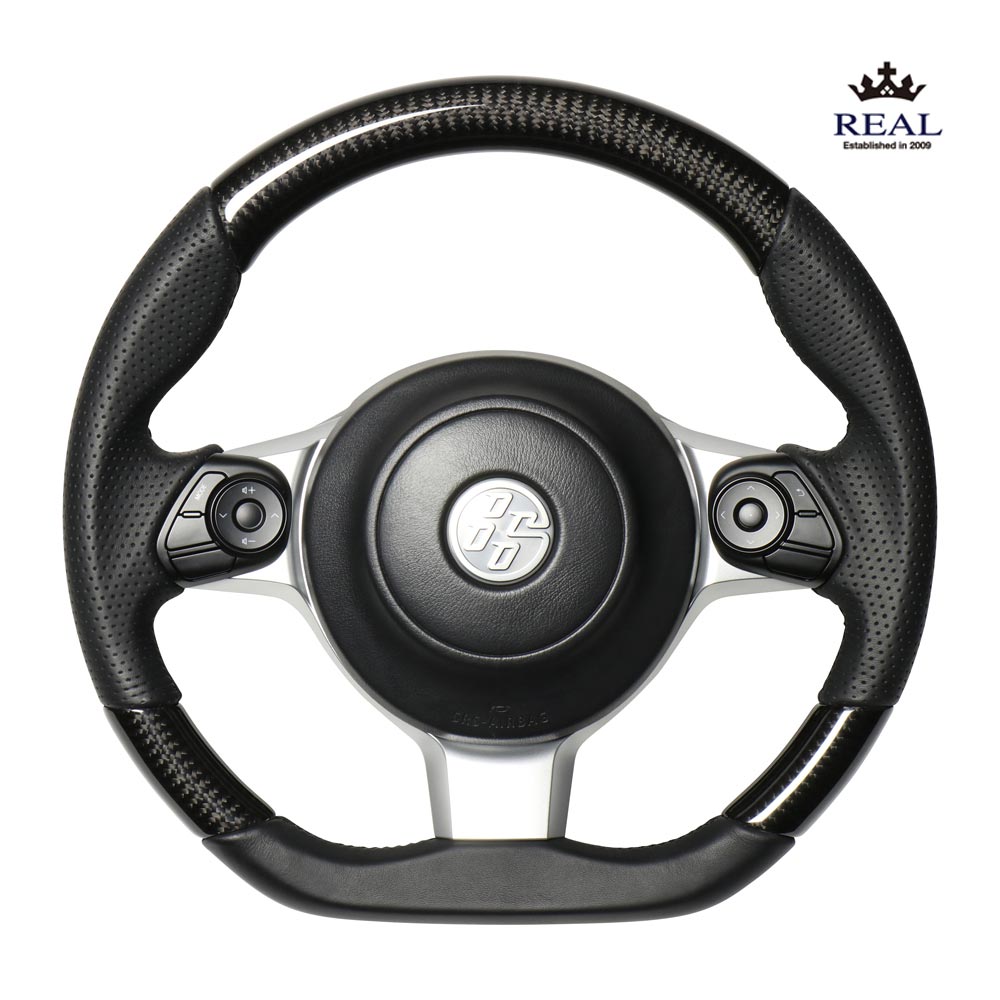 SUBARU BRZ　ZD8 用 レアル ステアリング オリジナルシリーズ ブラックカーボン　(ブラックユーロステッチ)　品番： GR-BKC-BK　(REAL Steering 純正交換タイプ) ※送料無料 (沖縄県および離島は除く)