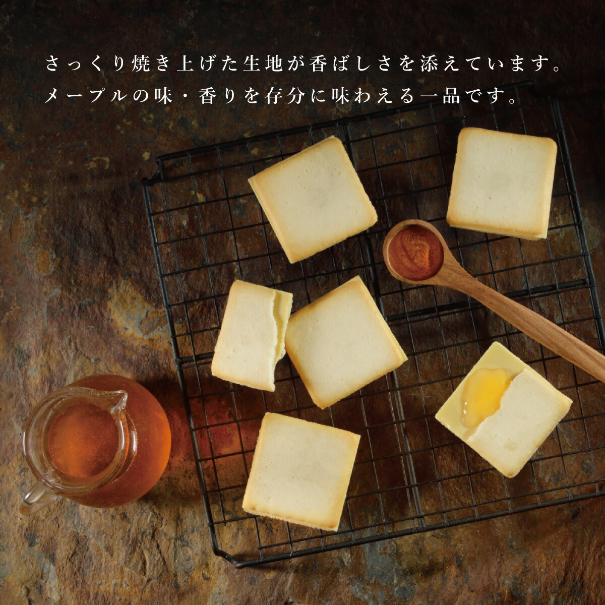 An image of a French toast-flavored Langue de Chat cookie with a white chocolate filling, baked to perfection and drizzled with maple syrup. The cookie has a light golden-brown color and a long, thin shape with a slightly curved end. The white chocolate filling can be seen oozing out from the center of the cookie. The maple syrup is drizzled generously over the top of the cookie, adding a rich and sweet flavor. The image captures the delicious and indulgent taste of this unique treat