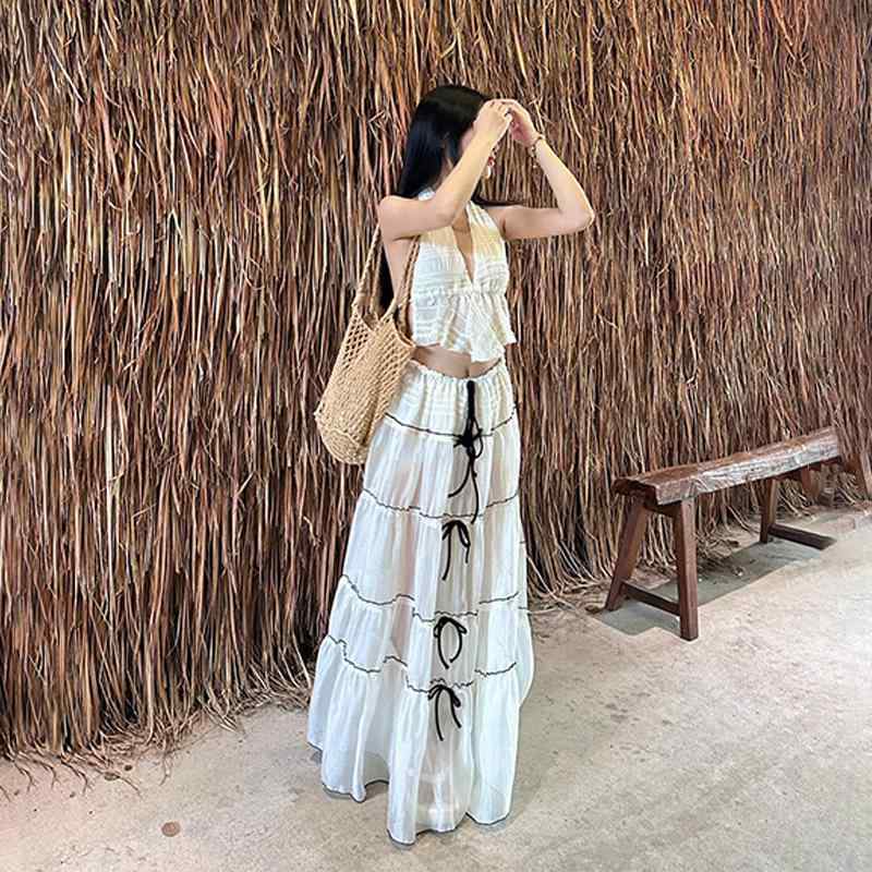 春 コーデ レディース ファッション オシャレ カワイイ シンプル きれいめ ナチュラル 上品カジュアル 婦人服 衣装 シースルー プリーツ ホルターネック ベスト チューブ トップス スカート スーツ
