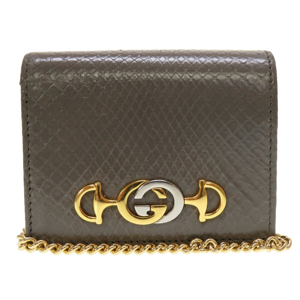 GUCCI GGロゴ 蛇デザイン 二つ折り財布　中古品 GUCCI グッチ 二つ折り財布 ロゴ型押し ブラック レザー 男女