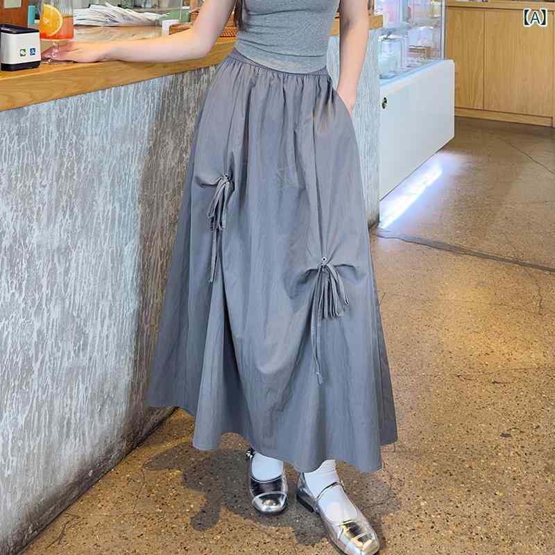 スカート 女性用 春夏 半身スカート Aライン ハイウエスト 遮胯 スリム 垂感 中長丈 大きめプリーツ 傘型 タッセル 蝶結び アイスクリームカラー グレー ブラック ホワイト ポリエステル ナイロン 混紡 軽量 無弾性 日韓カジュアル 普段使い トッ