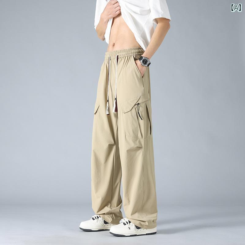 大きい サイズの 工 装 ズボンの 男性の 夏の 薄い タイプの 涼し さの広 脚の 男性の ズボンの カジュアルな ストレートの 筒は 太って 太って いる 人の 氷の ズボンを プラス します。