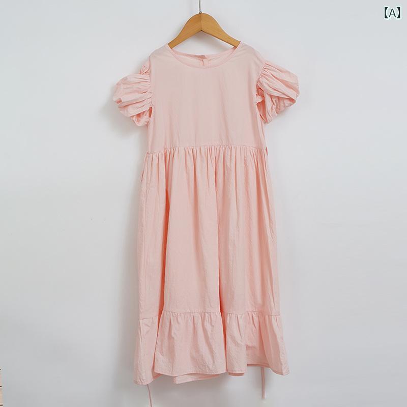 女の子の ワンピース 夏の 韓国 版 子供 服の 袖口が 交差 して います。