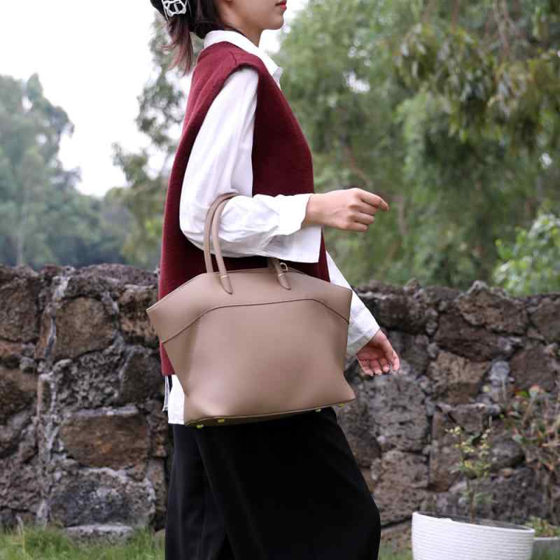 御膳上等感 手提げ 翅膀包 牛革 大電気容量 通い 百搭 斜?包 女 托特包