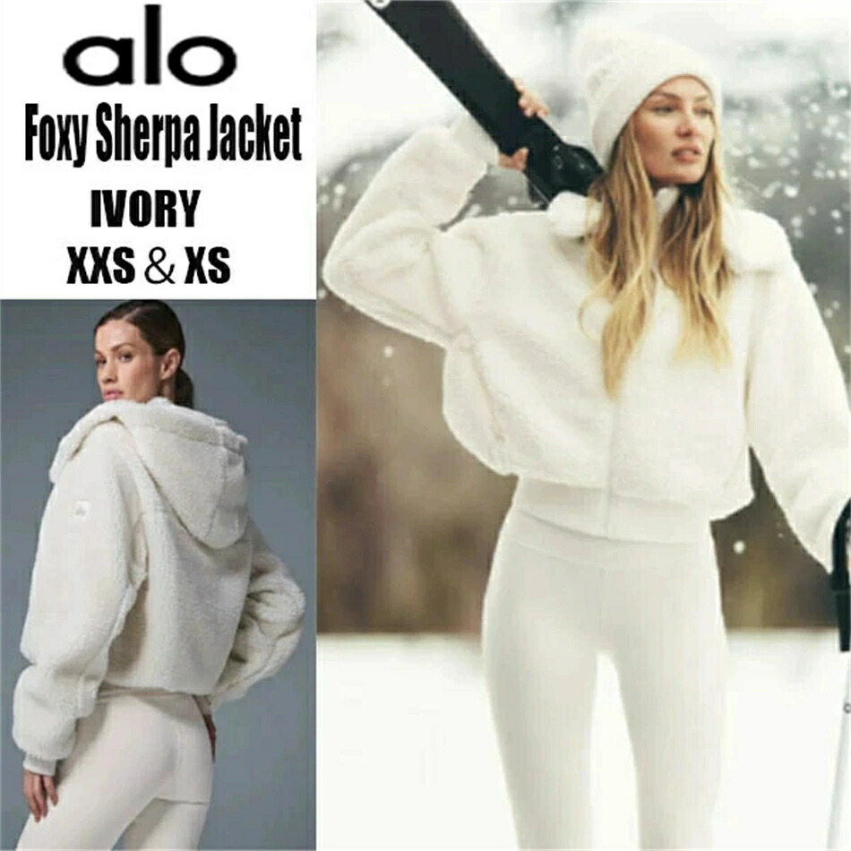 alo Foxy Sherpa Jacket フォクシーシェルパジャケット アウター 御居処丈 取りはらい能力のあるなボンネット 高めの襟 フロントジップ 肋材編みの袖と裾 ゆったりとした着心地 遊撃手丈 短丈 モコモコ ふわふわ 毛皮厚地の外套 アウター 厚地の外套