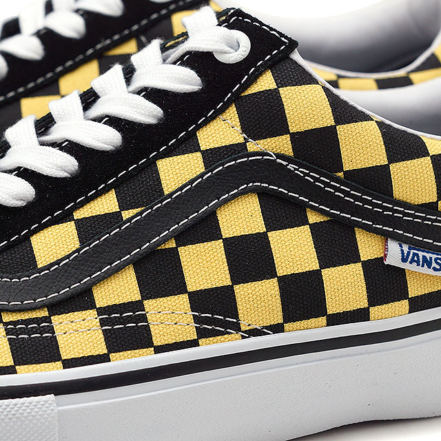 checkerboard vans with yellow line