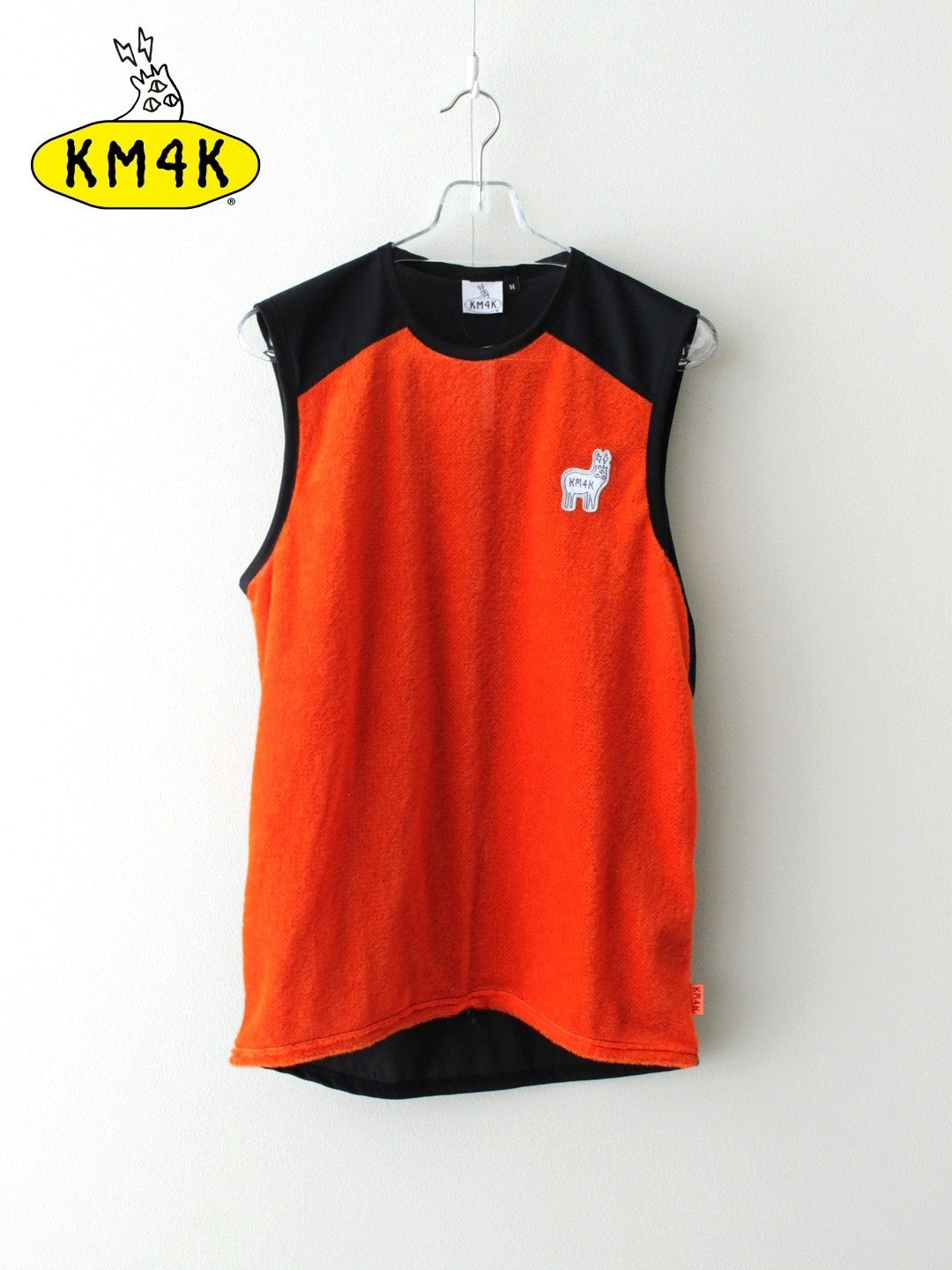 KM4K カモシカ｜25/26模範例 PARADICE 1.5 LAYER TOPS #ORANGE エデンの園 1.5 レイヤーベスト