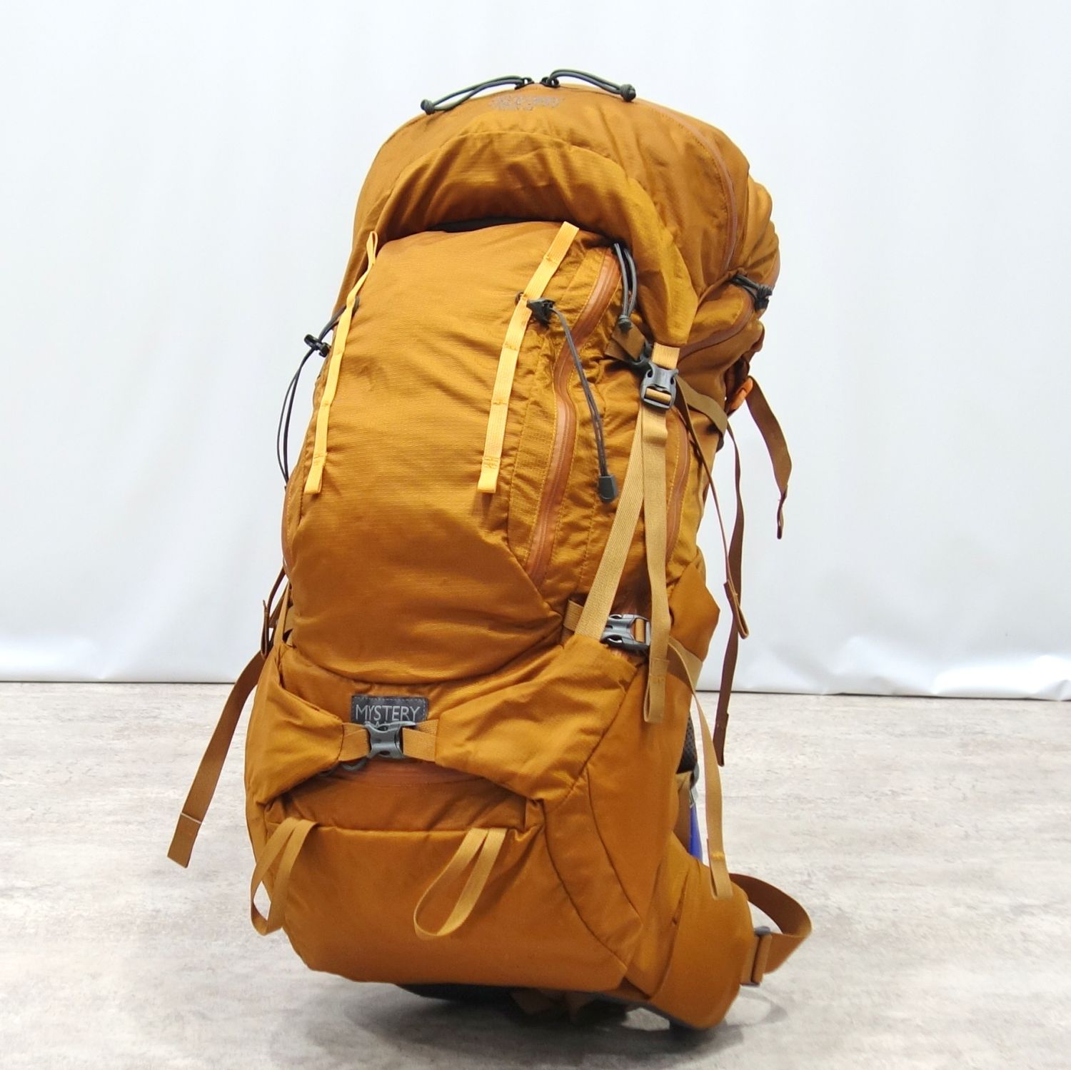 【美品】不可思議夕ご飯 MYSTERY RANCH うしろ側容器に並べる STEIN 62 スタイン 62L 大型 背嚢 山登り アウトドア オレンジ色【中古】