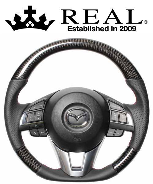 REAL STEERING オリジナルシリーズ マツダ アクセラ 前期 BM/BY系用 カラー：ブラックカーボン(レッド&times;ブラックユーロステッチ) (MZA-BKC-RD)【ハンドル】【自動車パーツ】レアル ステアリング｜矢東アウトレットショップ