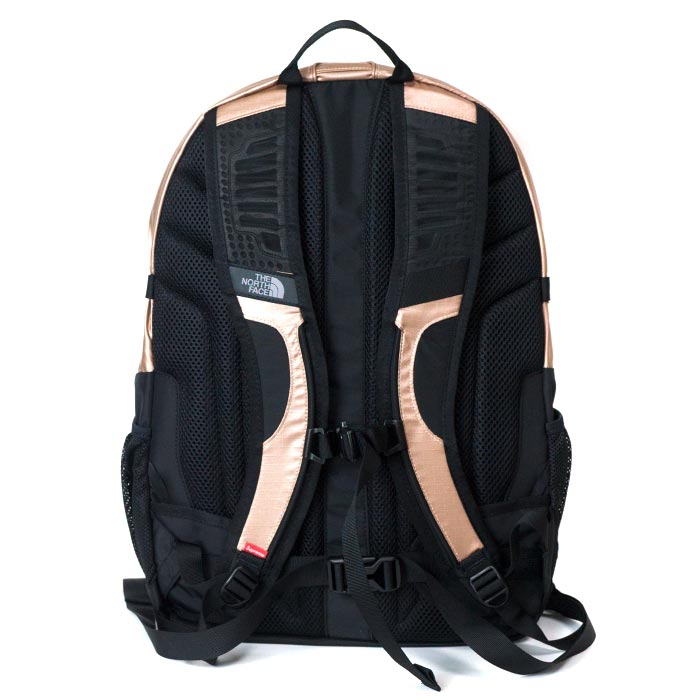 gold supreme north face backpack