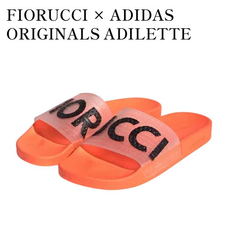 【お取り寄せ商品】FIORUCCI × ADIDAS ORIGINALS ADILETTE SLIDES SOLAR ORANGE/SOLAR GOLD/BLACK フィオルッチ × アディダスオリジナルス アディレッタ スライド ソーラーオレンジ/ソーラーゴールド/ブラック G28915 メンズ レディース 人気 おしゃれ